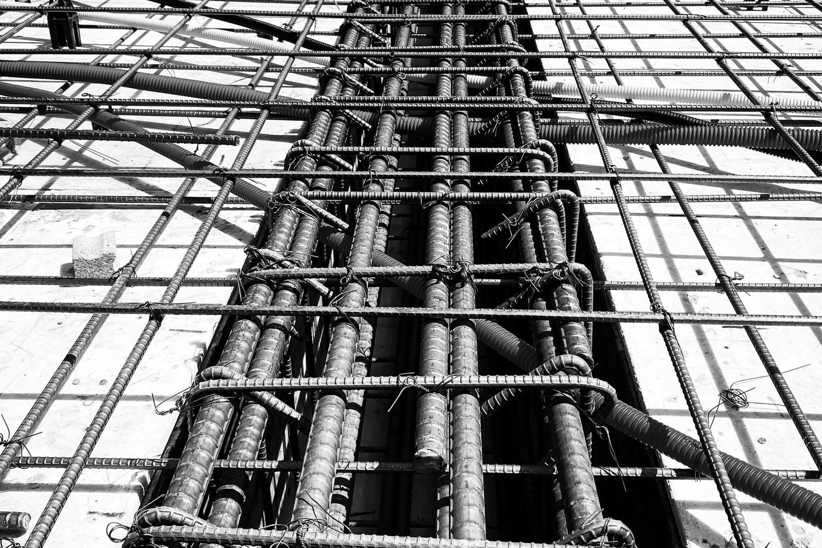 Reinforcement, couplers and service conduit set out before a pour
