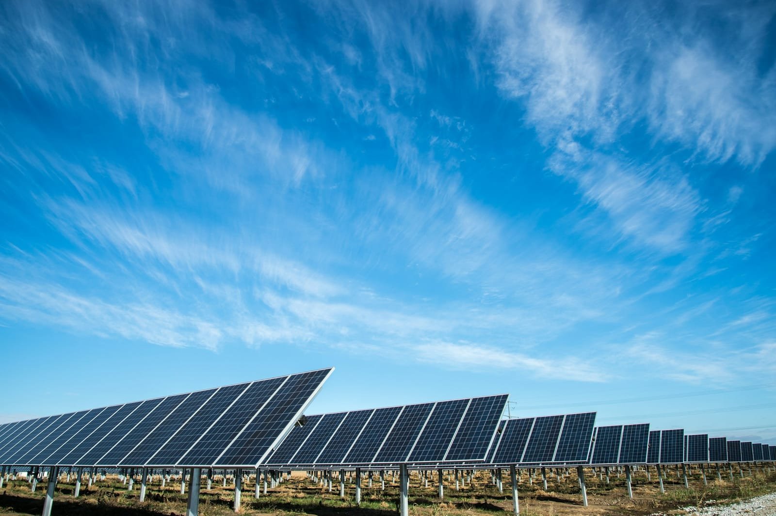 A utility-scale solar array under open sky