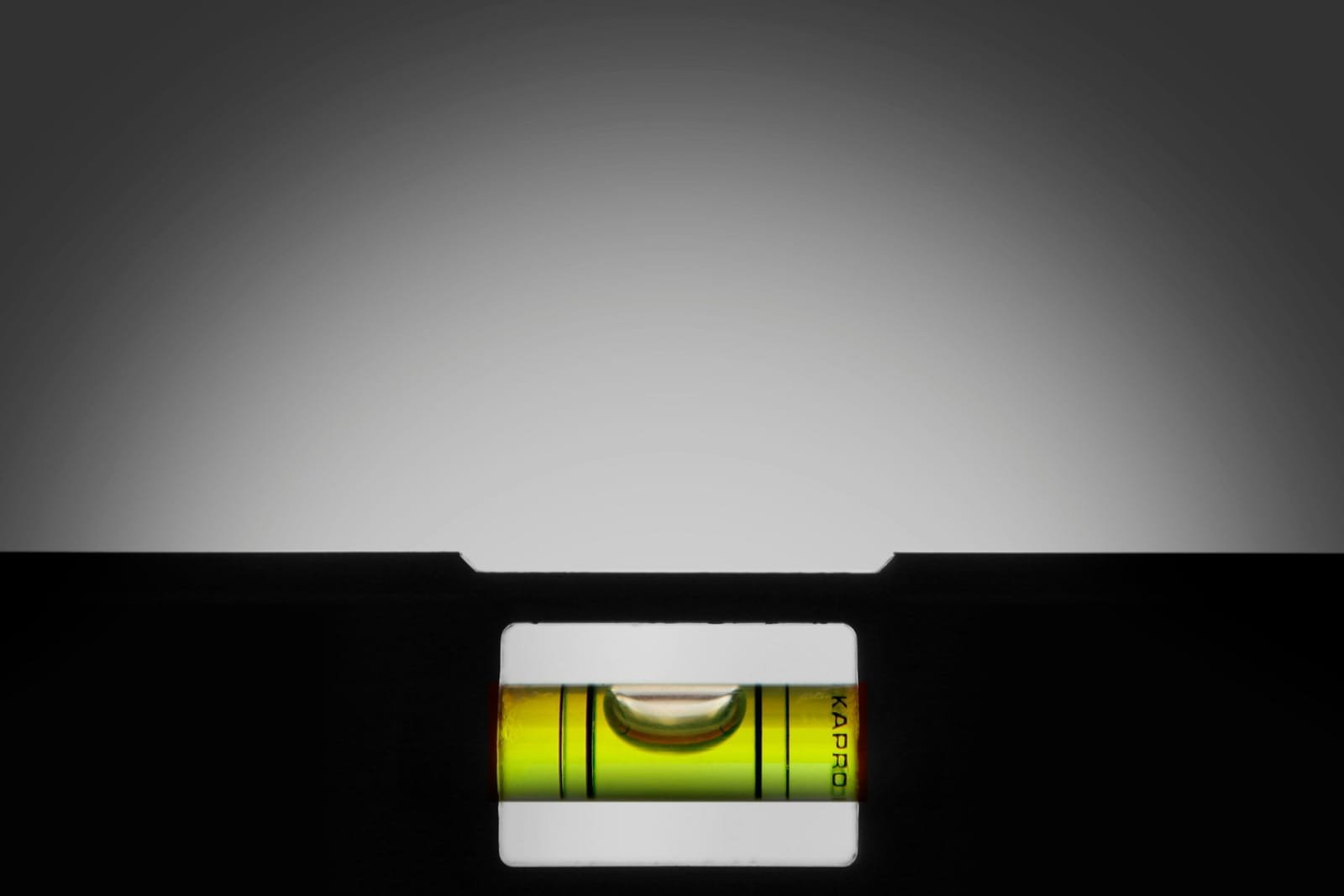 A spirit level with the bubble sitting dead centre between the graduations